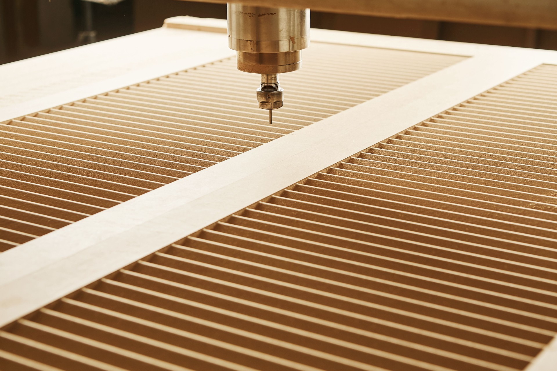 Machine with computer numerical control for cutting wood with various router bits.